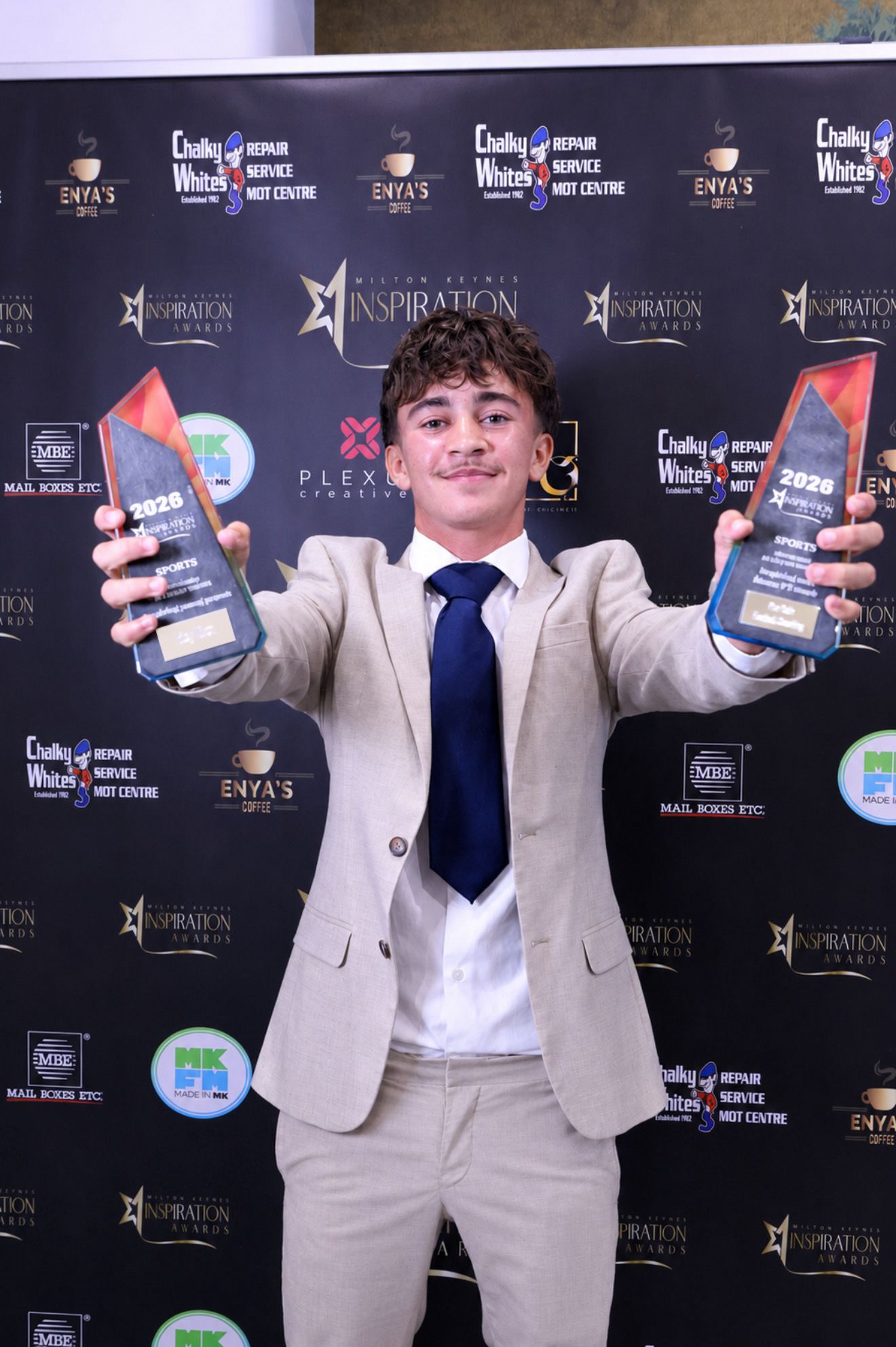 ProPath Football founder holding two MK Inspiration Awards